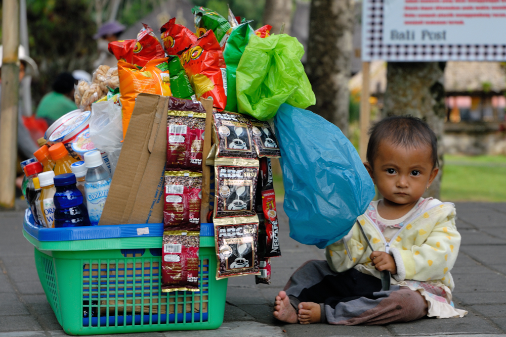 Young vendor at Pura Basukian Puse Jagat