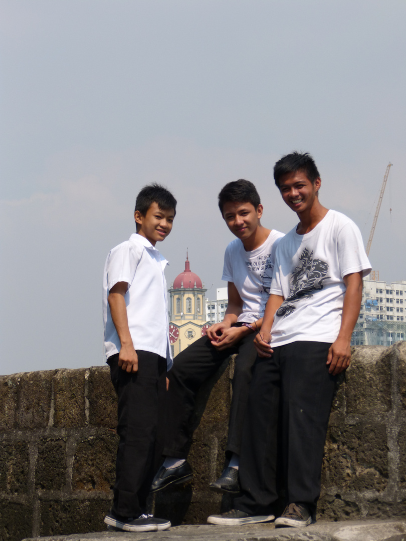 Youngsters on Intramuros wall plus City Hall