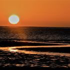 Z und Sonnenuntergang an der Lagune in Walvisbay